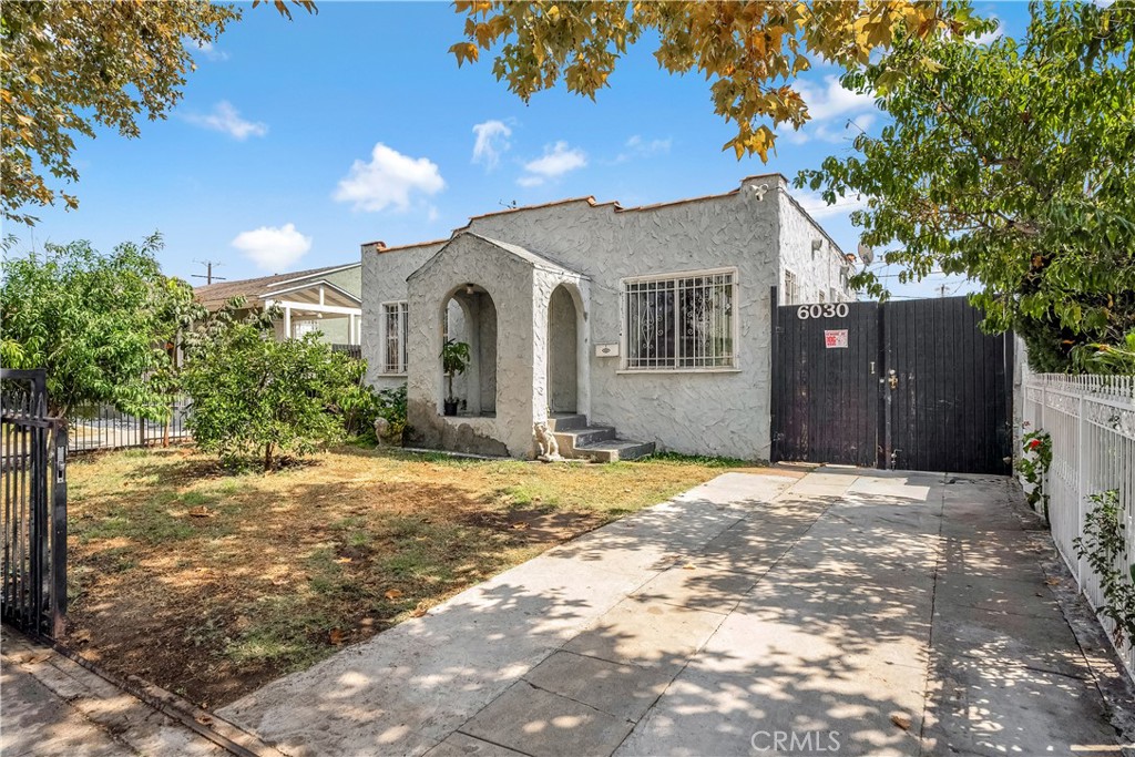 Welcome to this beautifully maintained single-family residency offering both comfort and income potential in the heart of Los Angeles. Thoughtfully updated over the years, this inviting property sits on a 4,129 sq. ft. lot and features a main home with 2 bedrooms and 1 full bath across 744 sq. ft. of living space, plus a separate ADU that creates endless opportunities for multi-generational living, rental income, or a private home office. Step inside the main home and you’ll find a warm and welcoming interior with original hardwood floors, a cozy living room fireplace, and plenty of natural light streaming through large windows. The kitchen includes tile counters, gas range, oven, microwave, and refrigerator, offering functionality and charm. Both bedrooms are conveniently located on the main floor, and the full bath features a classic shower-in-tub design. The property boasts freshly painted walls, wood and tile flooring, and carpet in select areas, creating a move-in-ready feel. Outside, enjoy both a front and backyard, perfect for gardening, entertaining, or simply relaxing in your private outdoor space. A large driveway provides RV parking possibilities, storage, or even the potential to be reimagined as additional living space. The true highlight of this property is the separate ADU, which expands its value and versatility. Whether you’re looking to generate rental income, provide a private space for extended family, or use it as a creative studio or office, this bonus unit makes the investment unbeatable. Situated in a vibrant Los Angeles community with sidewalks, curbs, and streetlights, this home combines classic 1920s character with modern potential. Whether you’re a first-time buyer, seasoned investor, or someone looking for a property with room to grow, 6030 W. Wilton is a must-see. Don’t miss the chance to own this unique Los Angeles gem with built-in rental opportunities—schedule your private showing today!