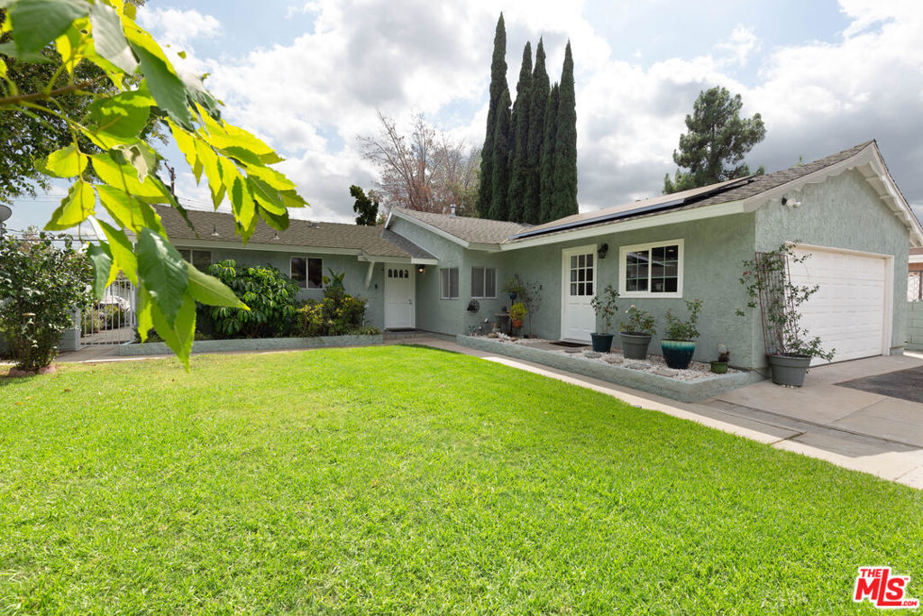 Nestled in a desirable Chatsworth neighborhood, this move-in-ready home has a meticulous, updated, and freshly painted interior and exterior. The kitchen features beautiful granite counter space and recessed lighting, offering both style and function. The spacious living room, adorned with elegant crown molding, flows seamlessly into the family room, where vaulted ceilings and a cozy fireplace create an inviting atmosphere. Stylish luxury vinyl plank floors create a seamless and elegant interior. The generously sized primary suite offers a private retreat with direct access to a sparkling backyard pool, perfect for entertaining and enjoying Southern California sunshine. Also, an office room adds functional space, while the two car garage has been smartly converted into a flexible bonus room with a private entrance, ideal for a studio, gym or additional guest bedroom suite. This space is easily highly adaptable for future conversion. Enjoy year round comfort with a brand new HVAC system, updated in 2024. This home combines modern updates with classic charm making it a special place to call your own.