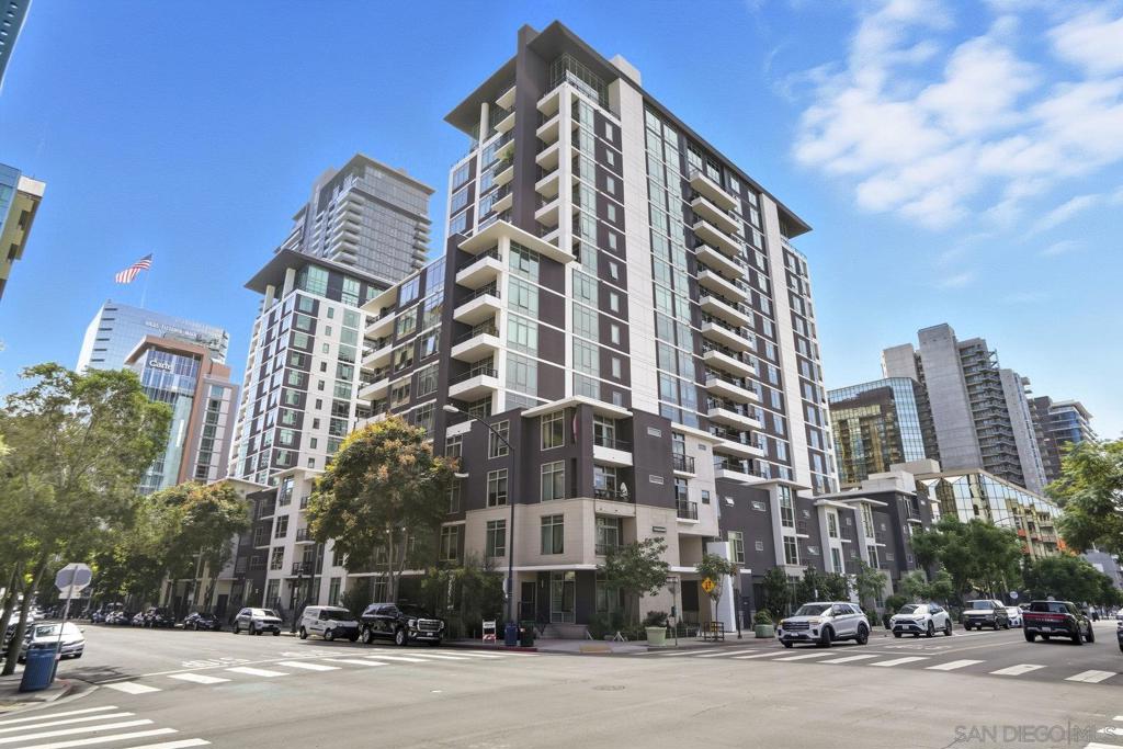 Located in the heart of vibrant Little Italy, this south-facing condo on the 10th floor of Acqua Vista offers the ultimate urban lifestyle. One of the few residences in the building to include a 4' x 12' deeded storage space in the parking garage, this home combines convenience, functionality, and style. Floor-to-ceiling windows bathe every room in natural light and frame sweeping city views, creating a bright and inviting atmosphere. The open-concept layout features a spacious kitchen with an eat-at bar that flows seamlessly into the dining and living areas—perfect for entertaining or everyday living. Just off the living room, a large private patio overlooks the city and bay, providing an ideal spot for morning coffee or evening relaxation. Both bedrooms are generously sized, and the home includes in-unit laundry, one assigned parking space, and the bonus of the extra storage space. The Acqua Vista building was recently remodeled and offers an impressive collection of resort-style amenities: valet parking, an 8th-floor rooftop pool and spa, fire tables, a BBQ area, a fitness center, EV charging stations, Amazon lockers, a package room with perishable notifications, full-time security, 24-hour concierge staff, and an on-site HOA manager. Aqua Vista is also a VA-approved community! All of this is just steps from award-winning restaurants, cozy coffee shops, the scenic waterfront, and the renowned Little Italy Farmers Market. Whether you’re searching for a full-time residence, a stylish second home, or a prime investment opportunity, this condo delivers an unbeatable combination of location, amenities, and value.