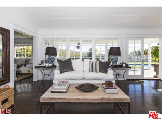 Incredible opportunity in the Palisades! Stunning 3 bedroom, 2.5 bath home with ocean views, pool and tennis court. This amazing property is situated on two adjoining separate lots and is being sold together for list price. Total combined lot size is 30,942 sq. ft. The impeccably designed one-level house features a wonderful floor plan with indoor-outdoor flow perfect for entertaining friends and family. Dark stained floors, vaulted ceilings, built-ins and charming details. Large kitchen with marble countertops, center island, professional appliances and large breakfast area. Formal living room and dining room. French doors throughout lead to grassy yard, covered porch, deck and sparkling swimming pool. Stroll through the yard to a beautiful tennis court surrounded by nature and mountain views. A truly magical, one-of-a-kind property that has been in the same family since 1973.