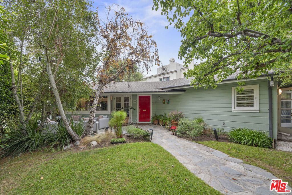 This one level Traditional/Contemporary residence sits at the northwest corner of 14th Street and Carlyle Ave. The property beautifully maximizes the corner lot with a variety of formal and informal rooms all surrounded by lovely hedged gardens. There are two primary bedrooms on separate wings with an additional den/office which could be placed back as the third main house bedroom. There is a modern eat-in kitchen and great room with vaulted ceilings, a formal living room with fireplace, an elegant dining room, and the converted den. (note to have the third bed in the main house, a third bath would need to be added). The converted garage on Carlyle currently serves as an office/guest room, offering excellent potential for an ADU. Being on the corner, the alley also provides an additional gated detached two-car garage, see photo. This allows for convenient access to the rear yard and kitchen. Since the property is fully hedged, outdoor living shines with a charming front patio and garden and there is a private backyard with dining patio. There are hardwood floors throughout. Seconds from the best part of Montana shopping and dining, and at the heart of your Santa Monica lifestyle, this property makes for a great long term value!