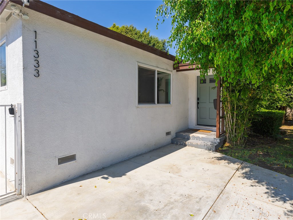 Welcome to 11333 Braddock Dr, a beautifully updated 6-bedroom, 3-bathroom mid-century home in the highly sought-after Blair Hills neighborhood of Culver City. This 2,390 sq. ft. gem, built in 1951, seamlessly blends classic charm with modern upgrades throughout. The open-concept living area is bathed in natural light, featuring gleaming hardwood floors and large windows that capture the surrounding greenery. The updated kitchen is a chef’s dream, with stainless steel appliances, quartz countertops, and ample cabinetry for storage. The spacious primary suite provides a peaceful retreat, while three additional bedrooms offer versatile space for a home office or guest rooms. Recent updates include a new roof, new high-efficiency furnace and AC, tankless water heaters, and energy-efficient windows. The exterior has been thoughtfully upgraded with a new driveway, walkway, and fully irrigated front and back yards—ideal for pets and relaxation. Enjoy the private backyard oasis with a manicured lawn, patio area for al fresco dining, and a hot tub for unwinding. The home also includes a charming unpermitted MILS (mother-in-law suite), with 2 bedrooms and 1 bathroom, that has been brought up to code. Located close to the 405 yet surprisingly quiet, this home offers the perfect blend of comfort, style, and convenience.