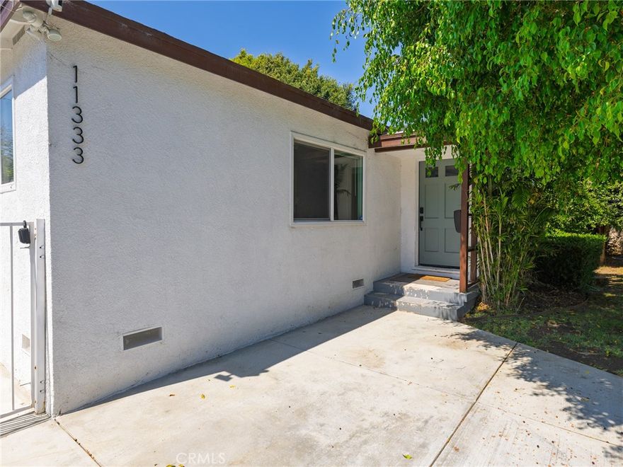 Welcome to 11333 Braddock Dr, a beautifully updated 6-bedroom, 3-bathroom mid-century home in the highly sought-after Blair Hills neighborhood of Culver City. This 2,390 sq. ft. gem, built in 1951, seamlessly blends classic charm with modern upgrades throughout. The open-concept living area is bathed in natural light, featuring gleaming hardwood floors and large windows that capture the surrounding greenery. The updated kitchen is a chef’s dream, with stainless steel appliances, quartz countertops, and ample cabinetry for storage. The spacious primary suite provides a peaceful retreat, while three additional bedrooms offer versatile space for a home office or guest rooms. Recent updates include a new roof, new high-efficiency furnace and AC, tankless water heaters, and energy-efficient windows. The exterior has been thoughtfully upgraded with a new driveway, walkway, and fully irrigated front and back yards—ideal for pets and relaxation. Enjoy the private backyard oasis with a manicured lawn, patio area for al fresco dining, and a hot tub for unwinding. The home also includes a charming unpermitted MILS (mother-in-law suite), with 2 bedrooms and 1 bathroom, that has been brought up to code. Located close to the 405 yet surprisingly quiet, this home offers the perfect blend of comfort, style, and convenience.
