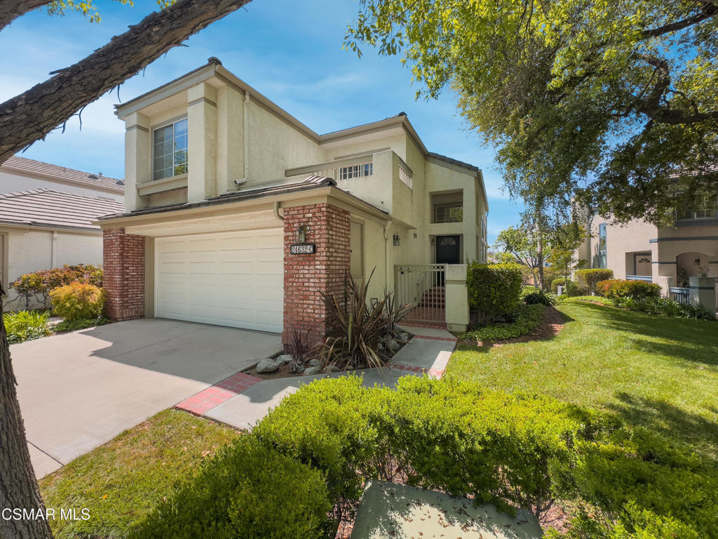 FANTASTIC View Home! Where sophistication meets nature. One of the most desirable floor plans located in the Stratford Gated Community in the Prestigious Valencia Summit. End Unit with Only 3 units per building NOT in a High Fire Zone!. This light and bright home features soaring ceilings, abundant natural light from multiple windows and skylights. The remodeled kitchen boasts granite counters, SS appliances, recessed lighting, pantry, desk space, and a wine cooler. Enjoy the family room fireplace and amazing canyon views. Convenient direct access attached 2 car garage, and an indoor laundry room makes chores a breeze. Rear yard backs to open space with more amazing views of the canyon. Plenty of Guest Parking close by. Quick Access to Freeway, Shopping, Schools, Medical Facilities, Parks, Paseo Trails. Homeowner's Association Amenities include Swimming Pools, Spas, Clubhouse, Tennis Courts and Hiking Trails. If Location Matters, this is it! NO MELLO ROOS. Don't Miss It!