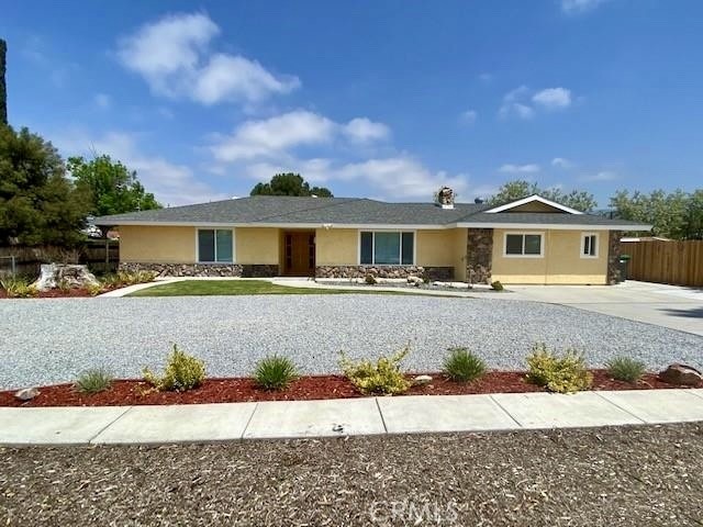 No HOA, No Mello-Roos taxes, Low property taxes. The initial home is a 3-bedroom, 2-bathroom. To the left, entering the hallway to the master bedroom with a new master bathroom, his and hers closet. The other two bedrooms face the lovely backyard and share the hallway's new bathroom. The kitchen is a total delight with White cabinets, quartz countertops, and stainless-steel appliances. From the kitchen, you go into the patio and to the backyard through the French doors. Also, from the kitchen, there is a direct entry to the new unit with two bedrooms, two bathrooms, a storage closet, and a laundry area. The garage was transformed into a 2-bedroom, 2-bathroom unit to fit the needs of the extended family. Each of these two bedrooms has its own AC unit for convenience and energy savings. The unit has a private entrance from the patio, LOW maintenance landscaped backyard with automated sprinklers and beautiful night lighting. You have amazing views of the San Jacinto Mountains right out of your kitchen window (No HOA, No Mello-Roos taxes, Low property taxes), Lot Size is 15,246, enough space for RV Parking.