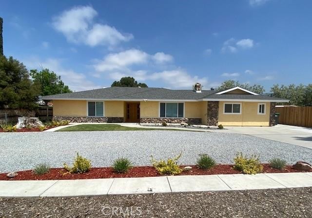 The Lot Size is 15,246 Sq Ft, No HOA, No Mello-Roos taxes, Low property taxes. The initial home is a 3-bedroom and 2 bathroom. To the left, entering the hallway to the master bedroom with a new master bathroom, his and hers closet. The other two bedrooms face the lovely backyard and share the hallway's new bathroom. The kitchen is a total delight with White cabinets, quartz countertops, and stainless-steel appliances. From the kitchen, you go into the patio and to the backyard through the French doors. Also, from the kitchen, there is a direct entry to the new unit with two bedrooms, two bathrooms, a storage closet, and a laundry area. The garage was transformed into a 2-bedroom, 2-bathroom unit to fit the needs of the extended family. Each of these two bedrooms has its own AC unit for convenience and energy savings. The unit has a private entrance from the patio, LOW maintenance landscaped backyard with automated sprinklers and beautiful night lighting. You have amazing views of the San Jacinto Mountains right out of your kitchen window (No HOA, No Mello-Roos taxes, Low property taxes), Lot Size is 15,246, enough space for RV Parking.