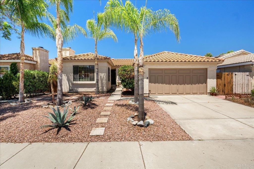 Nestled in the peaceful Lake Rancho Viejo neighborhood, this single-story home delivers a practical layout with modern updates and community perks. The 4-bedroom, 2-bath floor plan features LVP and tile flooring throughout, plus a kitchen equipped with granite countertops, stainless steel appliances, and a casual dining nook that flows into the main living area. The spacious primary suite includes vaulted ceilings, dual closets, and a private en-suite bath, while three additional bedrooms provide flexibility for guests, a home office, or hobbies. Outside, a low-maintenance backyard with mature fruit trees offers a quiet spot to relax or entertain. Enjoy access to community amenities such as a pool, spa, tennis courts, clubhouse, playgrounds, and walking trails. With convenient access to I-15 and Hwy 76, commuting is a breeze. This move-in-ready home combines comfort, location, and lifestyle—don’t miss your chance to make it yours!