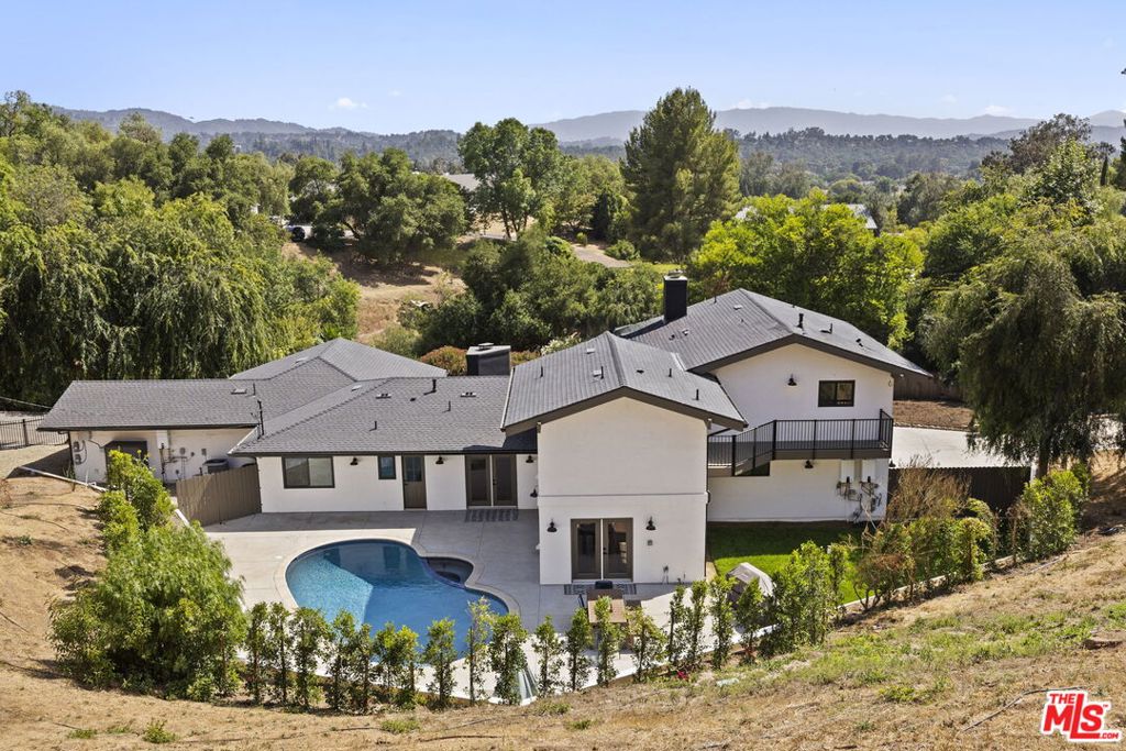 Welcome to 1131 Rancho Drive, an exceptional opportunity to own a beautifully renovated ranch-style home on just over an acre in one of Ojai's best neighborhoods. Boasting 3,934 square feet of elegant living space, this expansive property features 6 bedrooms and 5 bathrooms, thoughtfully designed to offer both comfort and versatility. The heart of the home is a chef's dream: a gorgeous kitchen adorned with designer tile, a large center island, and a walk-in pantry, perfect for entertaining or everyday living. Elegant and rustic hardwood floors run throughout, creating a seamless blend of modern refinement and classic ranch charm. Enjoy the flexibility of an attached JADU (Junior Accessory Dwelling Unit), ideal for guests, multigenerational living, or rental income. Step outside to a sparkling pool and beautifully landscaped grounds, offering space to relax, gather, and enjoy the serenity of Ojai. One of the property's standout features is the hillside lookout deck. Your private perch with stunning views across the valley, perfect for morning coffee or evening sunsets. This is a rare chance to own a turnkey home with scale, style, and soul in one of Ojai's most desirable enclaves.