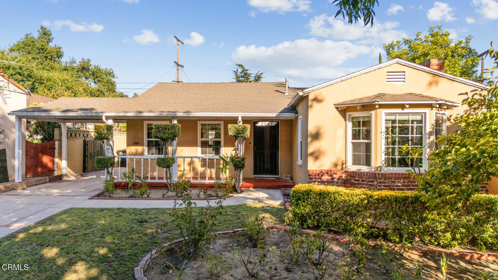 The highly sought after Sparr Heights is this traditional home's location, including its award winning public schools-- Fremont Elementary is just down the street--proximity to Montrose shopping with its annual special events like the Christmas Parade and Oktoberfest and farmers market, and twenty minutes to downtown Los Angeles. It's a true neighborhood with a feeling of safety and protection: neighbor friendliness, sidewalks and old fashioned street lights. The house boasts a manicured front lawn including a rose garden and mature Japanese persimmon tree. There's a formal entry with stone tile flooring and crystal chandelier. The spacious living room has a cathedral ceiling with exposed beams, a gas burning fireplace, a bay window fronting the street, built-in cabinets, gleaming hardwood floors and plenty of windows allowing natural light. The formal dining room has stone tile flooring, crown molding, a ceiling fan with lights, wainscoting, and lots of windows.The remodeled kitchen has crown molding, granite counters and splashback, double stainless steel sink with a reverse osmosis water filtration system, a hood vent over a Frigidaire 4-burner gas stove top, Magic Chef gas oven and broiler, LG microwave, canless recessed lights, a breakfast nook, access to the backyard and garage, plenty of custom wood cabinets, a wet bar, and a secretary desk. The hallway offers plenty of built-in storage drawers. There are three bedrooms, each with hardwood floors, crown and base board molding, and walk-in closets. There are two full completely remodeled bathrooms with stone-look tile, Kohler toilets, granite counters, double sinks with cabinets underneath, and showers over bathtubs with sliding glass doors. A bonus room could serve as an office or a nursery. The detached 2-car garage is finished with recessed lights, extra storage, laundry hook-ups and utility sink. Behind it, yet connected, is a workshed. The backyard is fully enclosed and flat. All the house windows are double pane, UV coated, vinyl. There's copper plumbing, a 200-amp electric main panel, wrought iron driveway gate, a porte-cochere, and a pergola towards the back of the driveway. This is the American Dream come true. What are you waiting for?