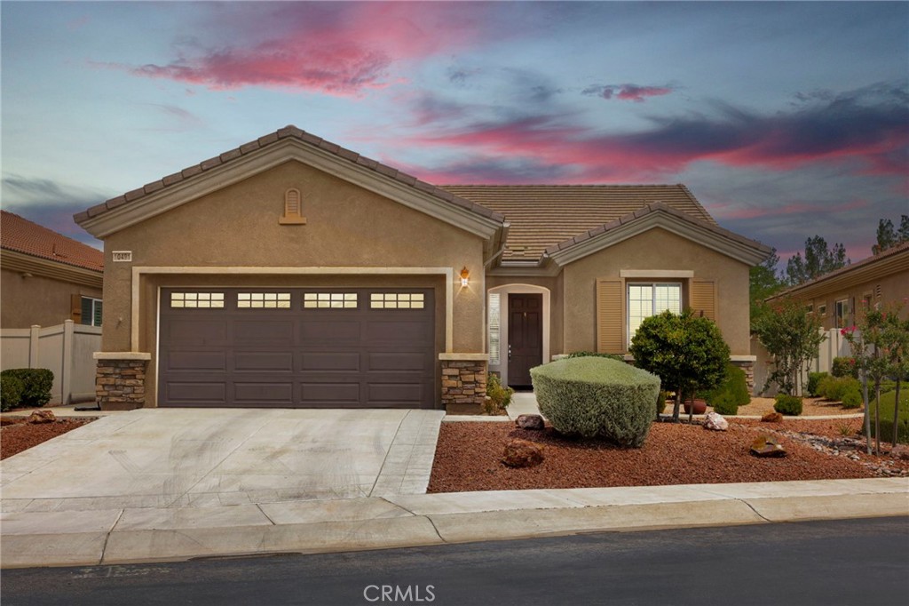 Discover easy living at 10491 Silverwood Rd! This beautifully maintained home features an open-concept layout where the living room flows into the dining area and kitchen, accented by pendant lighting, ample storage, stainless steel appliances, and all major appliances are included. Large windows fill the space with natural light, creating a bright and welcoming atmosphere. The primary suite offers a spacious retreat with a double vanity and walk-in shower, complemented by a guest bedroom and an additional versatile bonus room/office. The private, low-maintenance backyard includes a full-length covered patio—perfect for relaxing or entertaining. With a two-car garage and move-in ready design, this home blends style and convenience. The home is located within the Del Webb/Sun City gated 55+ community, offering enhanced security and peace of mind. The Aspen Clubhouse and Mariposa Lodge provide just about everything a resident could possibly be looking for whether it's with state-of-the-art gym equipment, a variety of fitness classes, join a club, activity or simply cool by one of the 4 pools. The clubhouses collectively feature an array of meeting rooms, library, ballroom, guest speakers, billiards room, and so much more. This home really offers it all, make it yours today!