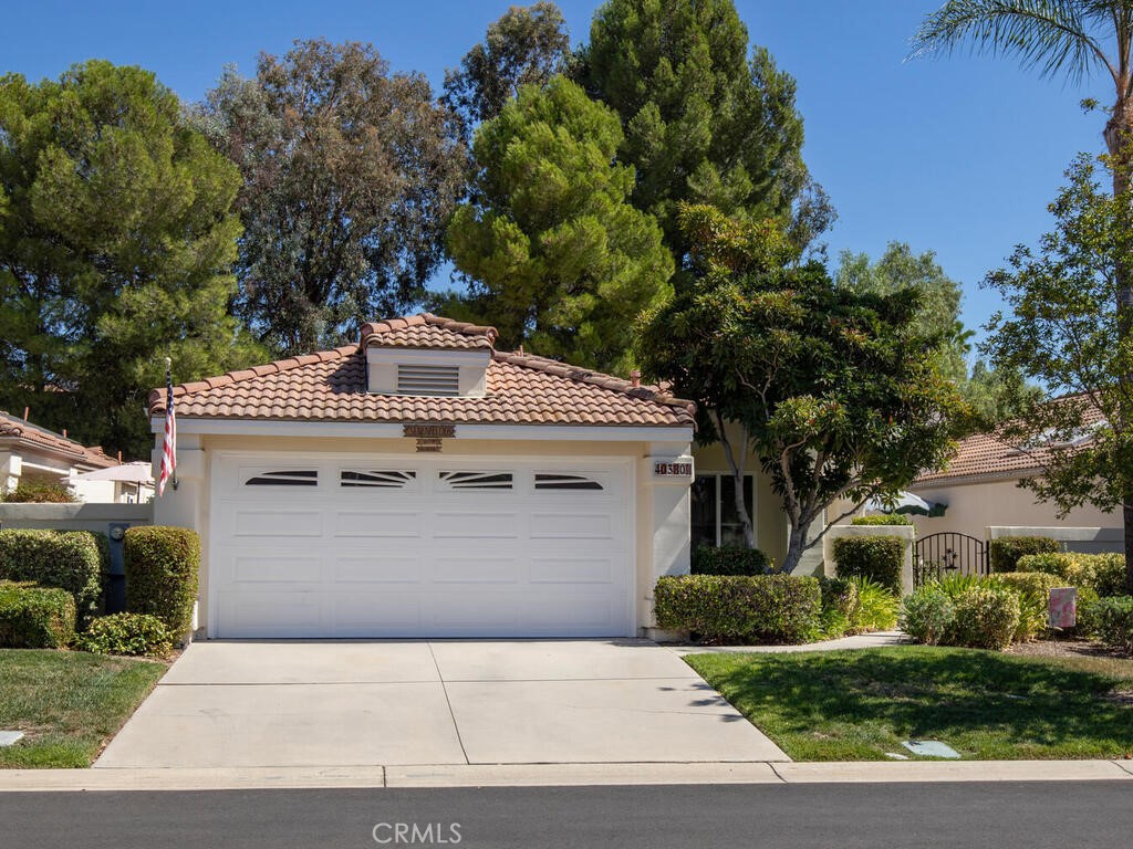 Located in the desirable Senior Community of The Colony Murrieta. The Colony is a private, gate guarded golf course community that features a renovated clubhouse, with amenities such as a library, billiard room, card rooms, fitness center, hair salon, large theater, tennis courts, pool & spa, plus a wonderful 18-hole public golf course.There are plenty of activities each week for any homeowner to participate in should they choose! This move in ready home has a gated front/side/back yard area with rockscape, pavers and patio. The interior features a well thought-out floor plan, with tall ceilings including a living room with fireplace and separate dining room. The kitchen offers tile counter tops, black and stainless steel kitchen appliances, pantry and eat in kitchen nook overlooking the back yard. Both bedrooms offer walk in closets and the primary bedroom has a sliding glass door to the backyard. The primary en suite bathroom features a separate tub, walk in shower and vanity area with dual sinks. The shaded backyard is highlighted by an alumawood patio cover. No neighbors directly behind as it backs to an HOA maintained slope with lush landscaping and plenty of privacy! The front yard water and maintenance is handled by the association. The oversized 2-car garage has built in cabinetry and even room for a golf cart! Ready for new owners to make it home!