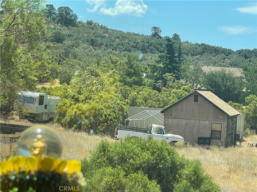 Welcome to this unique 5-acre property full of potential. The land is equipped with 14 greenhouses, two gardens, and two private wells that provide an abundant supply of pure spring water, making it a farmer’s dream. A septic system and a large workman’s garage are also in place, offering the essentials for a working farm or off-grid lifestyle.
The single-family residence features three bedrooms and two bathrooms and is in need of TLC, providing the perfect opportunity for someone to restore and create their own farmhouse retreat. With ample water, fertile land, and room to grow, this property is ideal for farming, homesteading, or building a sustainable lifestyle in the peaceful Anza community.
