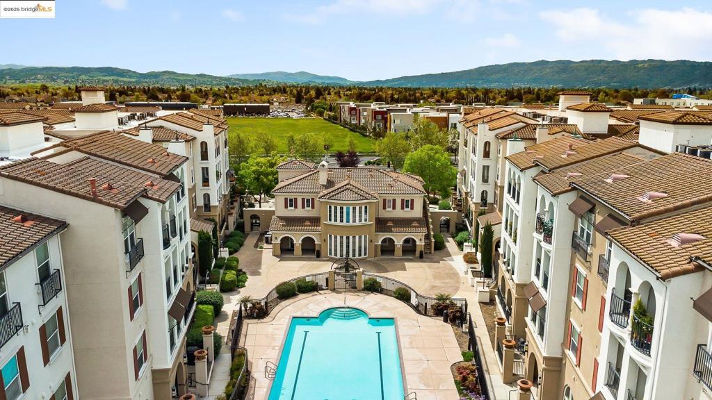 Beautifully Updated 2 Bed, 2 Bath Condo in The Terraces at Dublin Ranch Villages. Welcome to this stylishly updated 2-bedroom, 2-bath condo nestled in the highly desirable Terraces at Dublin Ranch Villages. This thoughtfully designed home features an open-concept floor plan with a welcoming entryway that flows seamlessly into the dining area, modern kitchen, and spacious living room. Enjoy cozy evenings by the gas fireplace or step out onto the private balcony overlooking tranquil fountains and lush landscaping. The updated kitchen showcases granite slab countertops, ample cabinetry, and recessed lighting. The serene primary suite offers peaceful courtyard views, a generous walk-in closet, and a beautifully updated en-suite bathroom with dual sinks and a walk-in shower. The second bedroom also enjoys courtyard views and easy access to a full bath with a shower-over-tub combo ideal for guests or a home office setup. Residents of this gated community enjoy amenities including a sparkling pool and spa, fitness center, theatre room, conference rooms, and clubhouse. Experience convenience and peace of mind. Perfectly located just minutes from top-rated East Dublin schools, popular dining spots, shopping, BART, and the 580/680 freeways.