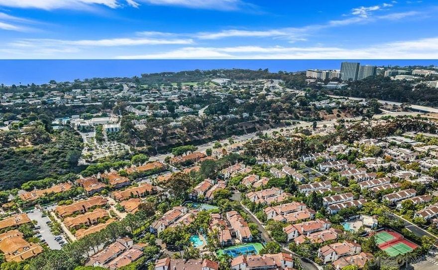 Perched on the quiet northwest corner of the resort-styled Villas Mallorca complex, this exceptionally private end-unit townhome enjoys forest-like views to the north and west. The home features a thoughtfully redesigned kitchen, large balcony off living/dining, vaulted ceilings in the bedrooms, natural light, & loads of storage space. Attached 2-car garage offers spacious laundry area and room for toys. Complex offers pool, spa, & lighted tennis court all amid luscious gardens. Conveniently located across the street from shops, restaurants, cinema, & fitness studios. Near beaches, UCSD, public transportation, & freeway access. The best of Villas Mallorca.