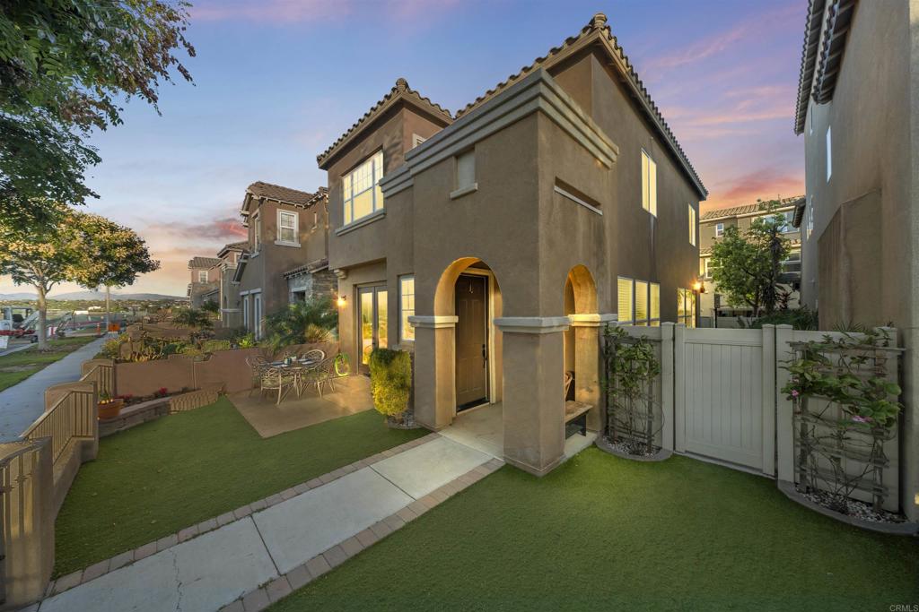 Welcome to your new home in the highly sought-after Montecito community of Otay Ranch. Designed with comfort and convenience in mind, this light-filled two-story home features a bright, open floor plan with seamless flow throughout. Start your day on the inviting front porch, the perfect spot to sip your morning coffee or unwind in the evenings. Inside, large windows flood every room with natural light, accentuating the brand new flooring (installed just last month) and freshly painted walls that give the home a fresh, modern feel. The open-concept kitchen offers a granite island, stone backsplash, open pantry, and new stainless-steel refrigerator and dishwasher. The spacious living room with a cozy fireplace creates the perfect gathering space for family and friends. Upstairs, all four bedrooms are conveniently located, including the generous primary suite featuring dual vanities, a soaking tub, and walk-in shower. One secondary bedroom includes its own private balcony, offering a peaceful retreat. The upstairs laundry room with a sink and built-in cabinets adds everyday ease. The two-car garage provides added functionality with cabinets and racks for extra storage. Outdoors, enjoy a private backyard and side yard with stamped concrete, perfect for entertaining or relaxing. Energy efficiency is a bonus with 17 solar panels, offering both sustainability and savings. Living in Montecito means more than just a home, it’s a lifestyle. The community offers resort-style pools, a state-of-the-art fitness center, clubhouse, bocce ball, BBQ areas, sports courts, playgrounds, and scenic biking and walking trails. Families will love the walkability to highly rated schools, local parks, and the convenience of being minutes from Otay Ranch Town Center, filled with shopping, dining, and entertainment options. With its family-friendly atmosphere, strong sense of community, and easy access to major freeways, Otay Ranch provides the ideal balance of suburban tranquility and urban convenience.