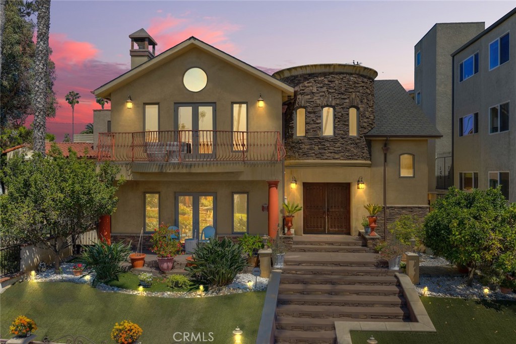 Some homes impress — this one welcomes you. Rebuilt from the ground up in 2007 with purpose and precision, this Mediterranean-inspired retreat blends timeless architecture with everyday ease, just moments from the beach and the vibrant energy of iconic 2nd Street — home to beloved cafés, acclaimed restaurants, and local boutiques.
Behind the classic façade lies a thoughtfully designed four-bedroom layout, where each bedroom offers a private en-suite bath and a fully built-out walk-in closet. With two bedrooms upstairs and two down, the floor plan provides flexible options for multigenerational living, guests, or a stylish home office.
The formal living room sets the tone for warmth and connection, featuring a cozy fireplace and French doors that open to a sunlit front courtyard — perfect for morning coffee or quiet moments under the sky. A junior suite downstairs, complete with its own fireplace and private entrance, makes an ideal guest retreat, creative studio, or wellness space.
Upstairs, the primary suite is a true sanctuary — expansive and light-filled, with dual walk-in closets, a spa-like bath, fireplace, and a private balcony where ocean views and coastal breezes become part of your daily ritual.
At the heart of the home, the chef’s kitchen is outfitted with Silestone countertops, Wolf range, GE Advantium oven, Bosch dishwasher, a central prep island, and a seating peninsula — designed for both quiet morning rituals and lively gatherings.
Throughout the home, maple-distressed hardwood floors, Marvin windows, and solid wood finishes reflect enduring quality. Smart upgrades such as dual-zone HVAC, two EV chargers, full wiring for sound and security, and attic storage offer both comfort and convenience.
Step into the backyard and discover a private outdoor oasis: flagstone pavers, low-maintenance landscaping, and a built-in kitchen with BBQ, sink, refrigerator, and fire table — made for sunset dinners and weekend celebrations that linger into the night.
Tucked just off the main street in coveted Belmont Heights, this home offers the perfect balance of coastal freedom and quiet luxury — with walkability to the beach, Rosie’s Dog Beach, the Colorado Lagoon, Naples Canals, and everything 2nd Street has to offer.
Come home to a space where craftsmanship, comfort, and connection live in perfect balance — and every day feels like vacation.