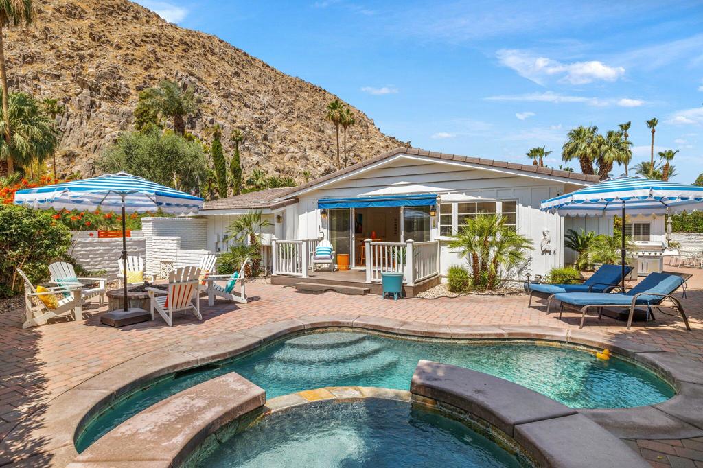 Welcome to your dream oasis at 77056 Desi Dr, Indian Wells, CA! This beautifully renovated single-family home offers a perfect blend of modern luxury and ultimate comfort. Spanning 1,916 square feet, this residence boasts three bedrooms and two elegant bathrooms, fully furnished to cater to your lifestyle needs. Behind the historic gates of Indian Wells Country Club, but without any HOA Dues!!Step inside to experience the allure of hardwood floors and the ambiance created by recessed lighting and exquisite chandeliers. The open floor plan seamlessly connects the living areas, making it ideal for both entertaining and everyday living. A dedicated home office provides a tranquil space for work or study.The kitchen, designed with modern conveniences in mind, flows effortlessly into the dining and living areas, creating a harmonious living experience. Each room is adorned with tasteful furnishings, ensuring you feel right at home from the moment you enter.Outside, your private retreat awaits. Relax by the pool or unwind in the spa, all set within a beautifully landscaped back yard. Enjoy alfresco dining on the expansive deck or cozy up by the fire pit on cool evenings. The private patio, enhanced with awnings, offers a serene escape for relaxation and leisure with unlimited mountain views.Discover the epitome of luxury living in a sought-after Indian Wells location. Don't miss this opportunity to own a piece of paradise, where every detail has been carefully curated for the discerning homeowner.