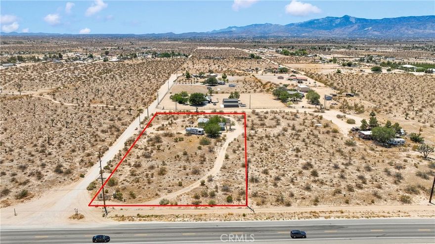 PRIVACY AND POSSIBILITY ARE ENDLESS HERE!  This two-bed, one-bath home (810 sq ft) is priced for an AS-IS cash offer!  Situated on a 2.01 acre corner lot that is zoned for horses, along paved Palmdale Road, you’ll be just minutes from town with multiple routes to LA, the Inland Empire and Central California.

Inside the fenced residence, you’ll find an open living area with a stone fireplace, spacious kitchen with lots of storage, breakfast counter, two bedrooms, and a full bath. The home is livable, with lots of potential for your personal upgrades. Utilities include propane heat, septic and public water.

Outside, a detached 3-car (681 sq ft) garage/workshop has plenty of space for vehicles, equipment, and tools, with a secondary outbuilding available for extra storage.  

With 2 acres, the possibilities are endless!  Add on or build a new home, plant a farm or store your equipment. With easy paved access from Palmdale Road and graded Buttonwood Street, this property appeals to small-business owners, contractors, big-rig operators or anyone craving space and privacy.

Bring your vision to this fixer-upper with a highly desirable location. Schedule your showing today and imagine the possibilities!
