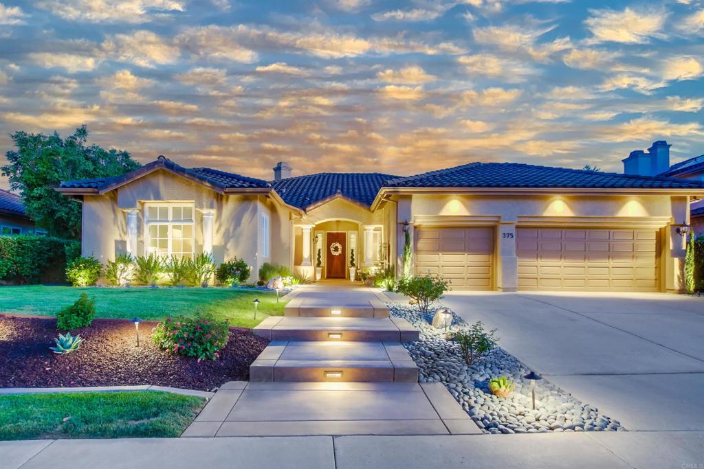 Welcome to 375 Camino Bailen Dr., a stunning 2,813 sq. ft. single-story sanctuary nestled in a prestigious gated community. This sophisticated 4-bedroom plus office, 3.5-bathroom residence blends modern elegance with unparalleled comfort, featuring a freshly painted interior adorned with exquisite crown molding and expansive baseboards. The spacious great room and family room are designed for relaxation and gatherings, while the gourmet kitchen boasts quartz countertops, stainless steel appliances, and a large island. The master suite offers a cozy fireplace, walk-in closet, and spa-inspired bathroom for ultimate tranquility. Outside, entertain effortlessly on the gorgeous covered patio with a fireplace, or unwind in the luxurious 7-person Jacuzzi, surrounded by breathtaking valley and hillside views. A state-of-the-art solar system promotes eco-friendly living, while the 3-car garage provides ample space for vehicles or storage. Beautiful accent and outdoor lighting enhances the home’s charm day or night, complemented by automated front and rear sprinkler systems and a dedicated dog run for pet lovers. With high ceilings, hardwood floors, smart home features, and an office for added versatility, this exceptional home offers the perfect fusion of luxury, functionality, and sustainability.