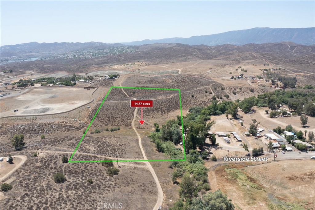 Land Development Opportunity – 14.69 Acres in Riverside County located just minutes east of Highway 74, this approximately 14.69-acre parcel offers 495 feet of frontage on Riverside Street with dimensions of about 495’ x 1,300’. Positioned on the border of Lake Elsinore’s Rosetta Canyon community, the land features gentle elevation and open meadows, providing beautiful views of surrounding neighborhoods. It's within the Meadowbrook Sphere District, offering potential for low to higher density residential development (buyer to verify with Riverside County). Utilities nearby include electricity (at the street), water (adjacent parcels), and sewer (west on Riverside Street). The area is rapidly growing, with new developments to the east and west. An ideal opportunity for builders and investors looking for land with strong development potential in a high-demand location.