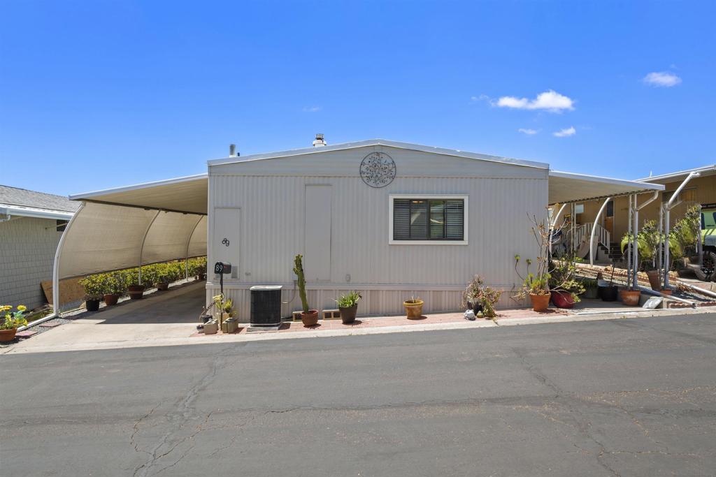Pride of Ownership in Terrace Estates! This 3 bedroom 2 bath manufactured home sits on a premium lot high atop the hill, offering panoramic westerly views and a variety of desirable features, both inside and out. Includes newer dual pane windows, laminate wood plank flooring, updated fixtures, A/C, large eat-in kitchen, full size laundry area, an additional 200+ square foot Arizona Room, covered carport parking, two storage sheds, and multiple outdoor patio areas for entertaining friends and family. Residence is located in a 55+ community, with numerous amenities and easy access to freeway, shopping, dining, public transportation, healthcare facilities, golf courses, casinos, and more.