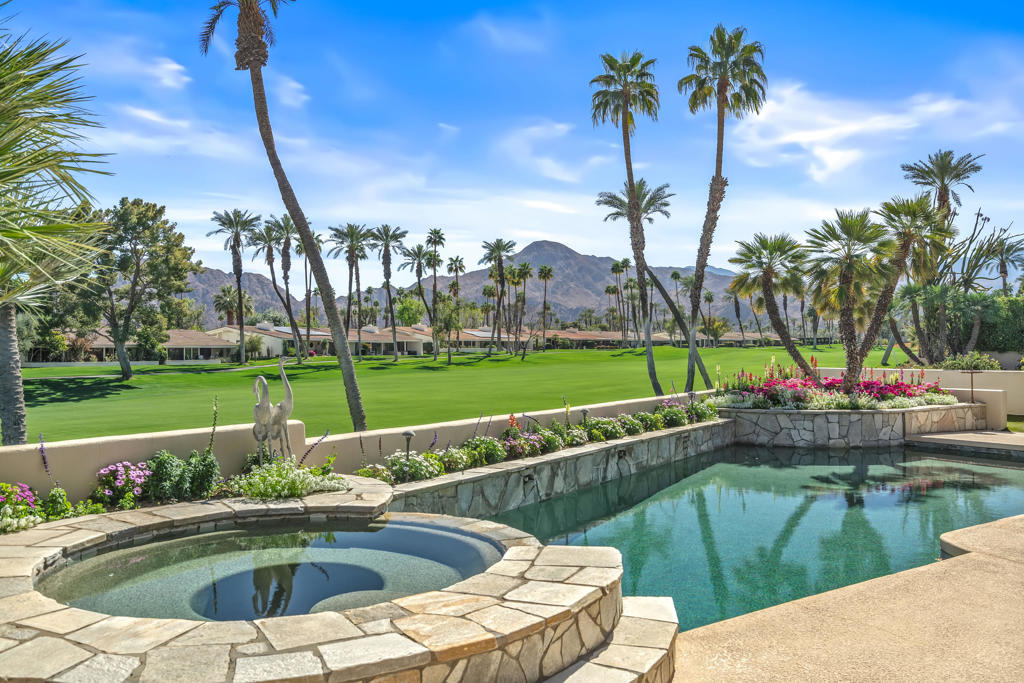 Premier elevated lot overlooking the private pool & spa, wrap around mountain views and the 1st fairway and green at Desert Horizons Country Club. The recently redone Clubhouse, Courts Complex and Exercise Facility are first rate! This Hazeltine floor plan offers almost 3,400 sq. ft. with 3 bedroom suites, a powder room, and a casita with a 4th bedroom. The expansive views are never ending. The generous patio spaces offer a tranquil and private setting overlooking the Pebble-Tec pool/spa with beautiful mountain and golf course views. This sought-after floor plan includes a formal living and dining room, a large family room and an eat-in kitchen. The high ceilings and abundance of windows offer a light & bright airy living space. Located in the heart of Indian Wells this home is desert living at it's best.