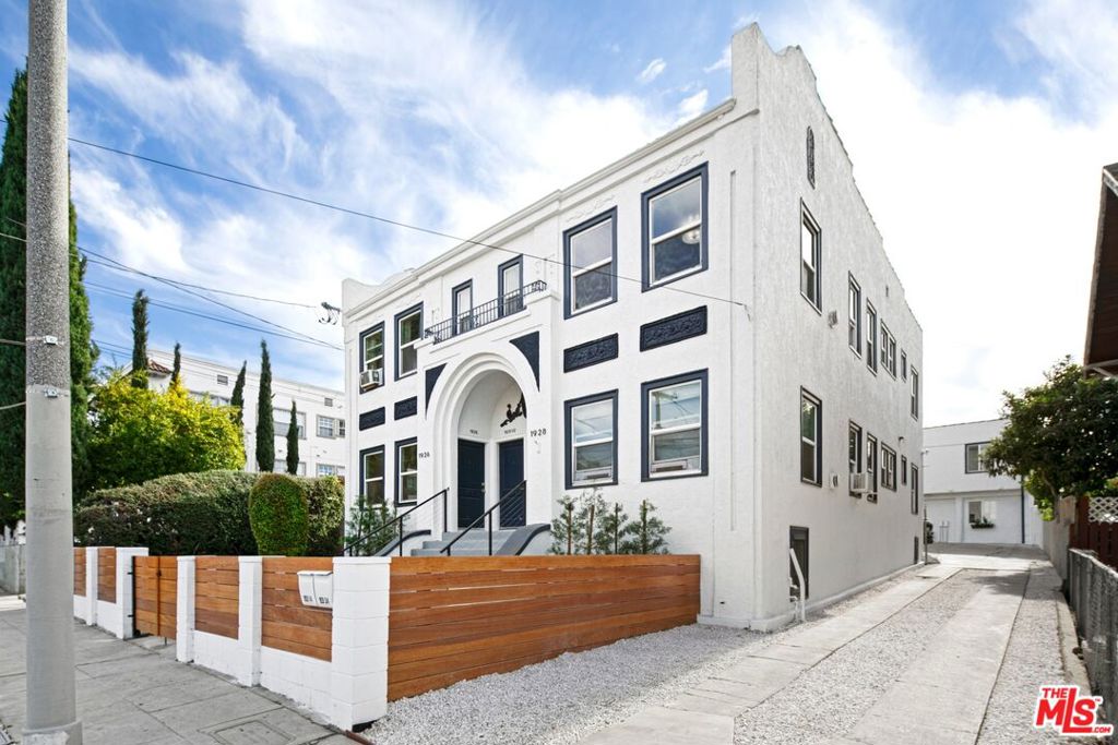 Bright and modern, this spacious 1BR/1BA apartment sits on the top floor of a charming 6-unit complex, located less than two blocks from Echo Park Lake and near some of the best restaurants, nightlife, and shopping on Sunset Ave. Your own private entry features a wide staircase (perfect for storing bikes, etc) and opens into an oversized living space that has cleverly been divided into two rooms - ideal for creating separate living/dining areas. A cozy nook, meanwhile, can be used as a mini office area, a tiny library, a pet space...the possibilities are endless! The updated kitchen features stone countertops, custom cabinetry, and stainless steel appliances (dishwasher, stove, microwave, and fridge). The stylish bathroom boasts designer tile and upgraded fixtures. Down the hall, you'll find additional storage, a sunny bedroom, and a rear entry. The apartment also includes ductless A/C & heat units, wood floors throughout, and in-unit washer/dryer. Cats and small dogs are welcome! Street parking only.