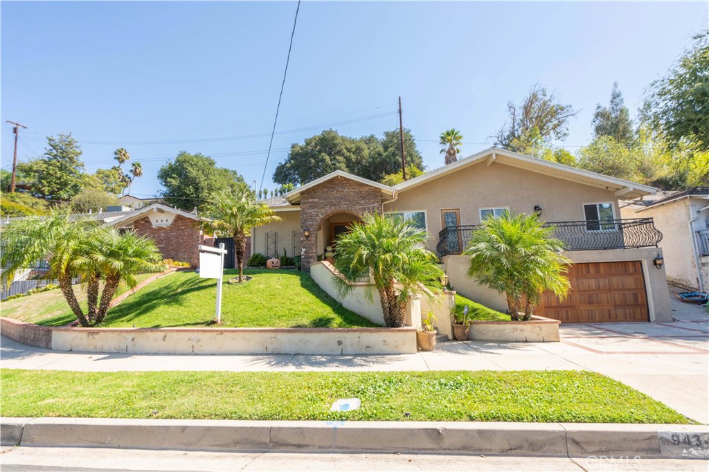 Welcome to this Walnut Cove beauty at the end of the most quiet Cul de Sac in Northridge.
As you drive up the street, you’ll notice the stacked stone archway entry leading to the double door with smoked glass and inlay of wrought iron, to match the wrought iron railing on the private patio.
There’s a custom wooden garage door to give the home an Estate appearance.
As you enter the double doors you’ll notice the Bamboo floors leading through the entire home with crown molding and baseboards. Three bedrooms and two full baths included in 1,700 sf of living space on a lot size of nearly 7,700 sf.
Smooth ceilings and recessed lighting give this home a luxurious effect. The cook’s kitchen is going to enjoy the all stainless appliances with 5 burner stove and built in microwave all from Samsung.
Deep double stainless sink with stainless modern fixtues with solid walnut cabinets with pull out spice drawer. Convenient walk in pantry and laundry off kitchen.
Nicely located dining area with archway leads to living room with wood burning tile fireplace and hearth and wood mantle over the fireplace.
Master bedroom has walk in closet, ceiling fan and master bath is tiled with full glass enclosure tub. Granite counters and smoked glass door with wrought iron inlay leading to private balcony.
Guest bedroom with large closet and organizer and bead board wainscoting and ceiling fan.
Full guest bath with laminate floor, tile counter and pewter fixures.
Dual pane vinyl slider leads to entertainer’s private backyard with slate floors, huge gas firepit and waterfall all covered with shaded nine foot high ceilings and columns.