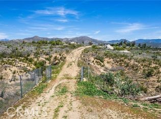 Discover the perfect canvas on Perryman Lane for your dream home on this stunning 5.4-acre residential rural lot in Hemet, CA. This property features a private well and septic tank, providing essential amenities for your future residence. With close electrical connections available, the possibilities are truly endless. Enjoy the tranquility and privacy this lot offers, while still being conveniently located near local amenities. Create your own oasis in this serene setting, where nature meets potential. Don't miss this opportunity to invest in your future!