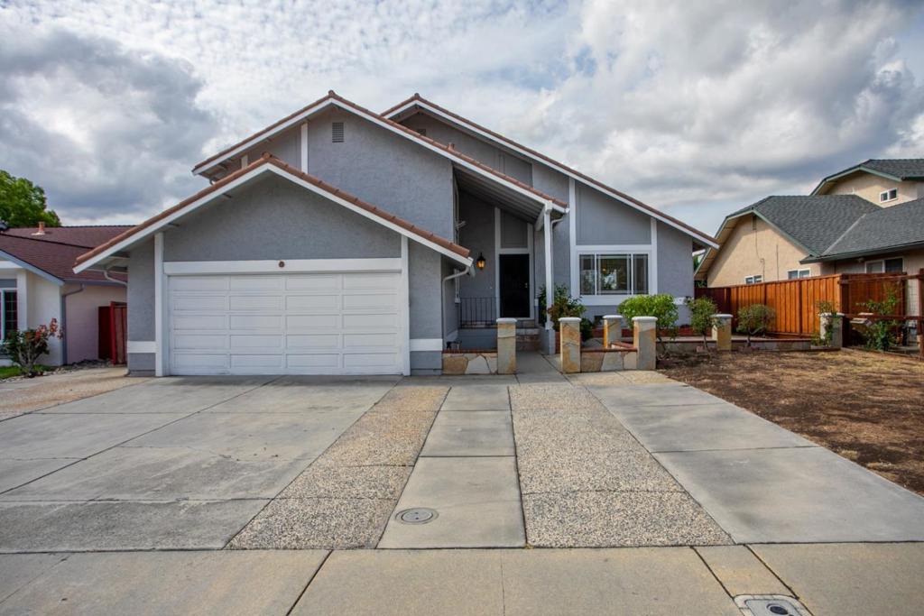 Welcome to this inviting single family home residence by Evergreen, offering a warm and functional layout with great bones and room to make it your own. The exterior showcases a clean design with a two-car garage, a welcoming entry, and low-maintenance landscaping. Step inside to find a bright kitchen featuring tile counters, wood cabinetry, and stainless-steel appliancesready for your personal touches. The spacious living room offers natural light, wood-style flooring, a sliding glass door to the backyard, and a cozy brick fireplace, perfect for gathering with family and friends. This home provides a wonderful opportunity for first-time buyers, investors, or anyone looking to customize a property to their liking. With its functional floor plan and solid structure, its a blank canvas waiting for your upgrades and design ideas. The backyard offers space for outdoor living, gardening, or creating your own retreat. Conveniently located near schools, shopping, and commuter routes, this property combines practicality with potential.
