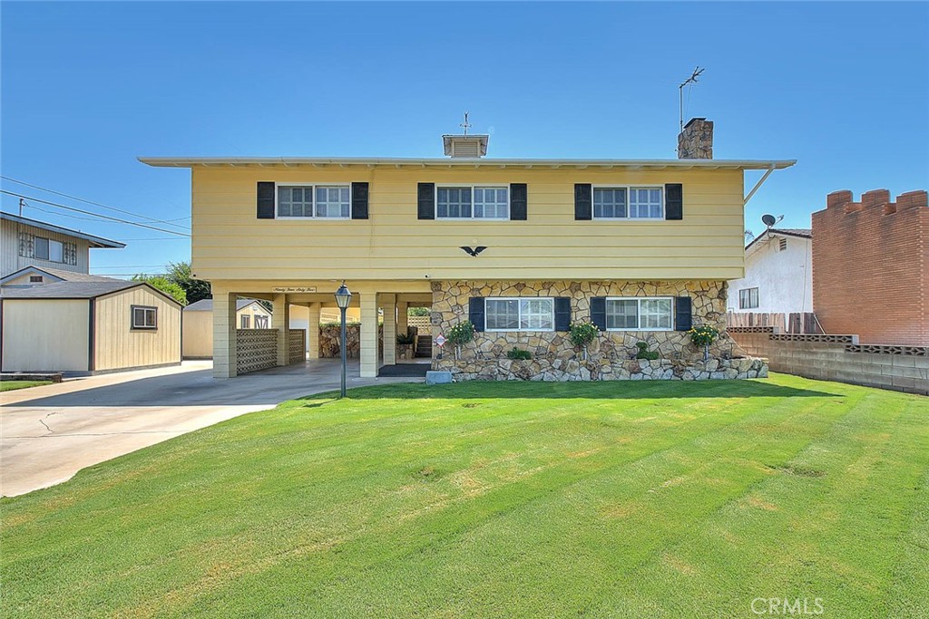 Come see this beautiful tri level home located in a high demand east side neighborhood of Fontana. This home offers four bedrooms and two and a half bathrooms with 2162 sq. ft. of living space all situated on a large 7840 sq. ft. lot. Spacious kitchen with an attached dining area and family room on the second floor. Separate living room, half bath and indoor laundry room on ground floor. All bedrooms and two additional baths are upstairs on third level.
There is a second level outdoor patio deck, carport and detached two car garage. Beautifully manicured lawns, recent exterior paint as well as two large storage sheds. Walking distance to Palmetto Elementary School.