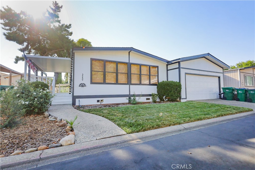 Family MHP that is clean and maintained. Double wide unit with a garage. This home has been maintained, painted, new awning with large patio, Fenced private back yard, remodeled bathrooms and kitchen laminate flooring. Washer and Dryer included. Park amenities include Pool, Playground, open grass area, club house and close to HWY 99 for easy commute. Plenty of parking at the club house for events. The seller has taken great care of this home and is ready to move in.