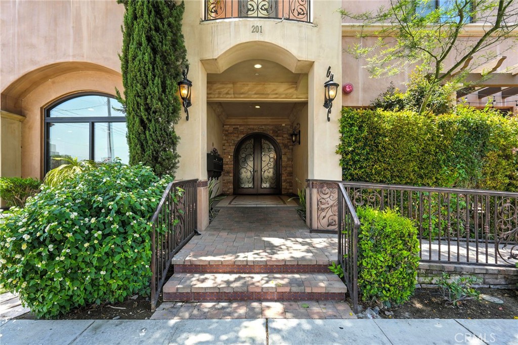 Stunning luxury condo at Villa Verdugo in the heart of Burbank. This custom boutique building of only 12 units was newly built in 2017. Spacious 4 bed + 4 bath floor plan with lots of open space. The kitchen is beautifully equipped with stainless steel appliances, a spacious island, soft close cabinetry, and beautifully appointed finishes. The living area features impressive floor to ceiling sliding glass doors that allow natural lighting in living room accompanied by a contemporary fireplace. Private patio with mature hedges. Discreet laundry area in airy hallway leading to bedrooms. Master bedroom features a pleasantly ample walk-in closet. Private parking underground with elevator access from the garage. Conveniently located next to trendy restaurants, shops, studios, and the best Burbank schools.