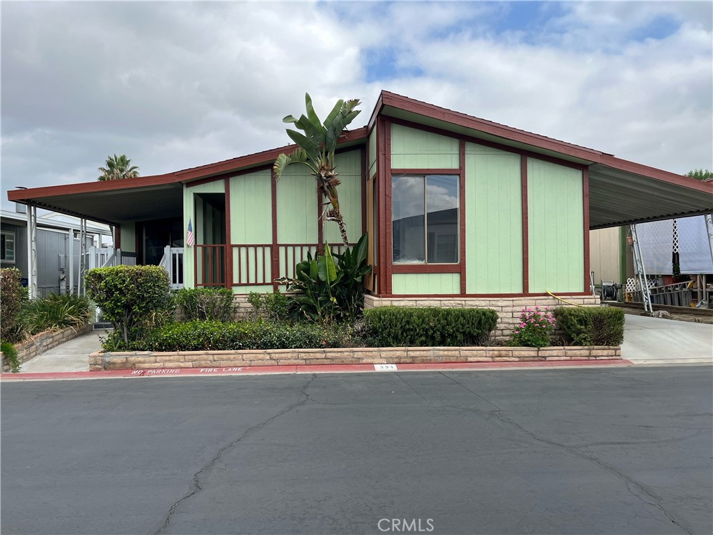 This beautifully updated mobile home is located in the exclusive Rancho Ontario community. It features a host of recent upgrades, including a new water heater, new furnace, and a freshly painted exterior. The community offers fantastic amenities for its residents, including a heated pool and spa that are open all year. The clubhouse has a variety of recreational spaces, such as a billiards room, a card table room, a fitness center, and a comfortable lounge area. For those who enjoy staying active, the park provides two pickleball courts and a bocce ball court. Your pets are welcome here too, with two dedicated dog parks.