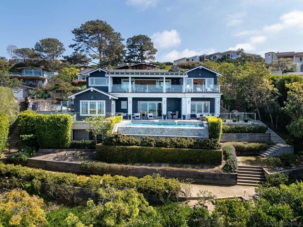 Elegantly crafted. Dramatic 180° panoramic ocean views. No other architect captures the essence of Del Mar quite like Bokal & Sneed. This 4+BR,5.5BA coastal craftsman unpretentiously refines the art of seaside living. Inviting. Timeless. There’s poetry in how the house is anchored so discreetly into the hillside, concealing the infinity-edge pool. Superior craftsmanship: custom built-ins, wide-plank white oak floors, expansive media room & gym. Walk everywhere! The Village of Del Mar and beaches are a quick jaunt.