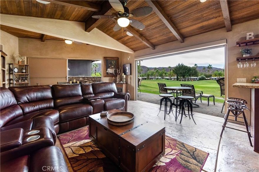 WOW!! This is the one... This lot has so much to offer, for sure a must see on your tour of the Resort. Let me start at the front of the lot, beautiful curb appeal with Palm Trees, Built in BBQ with storage and a Retractable Awning for extra protection or shade. Step inside through secure lockable doors to approx 750 sq ft buildout to a Full Kitchen w/ Granite Counters, Residential Stainless Steel Frig, Stove and oven. So much counter space & storage for your stuff that you need to cook and clean, moving out of the kitchen into the Dining & Family Room area all Stained Stamped Concrete looking out onto the Golf Course & Pond thru Double Screens for privacy and protection from the elements. There is a patio to watch the Golfers and take in the Sunset with the protection of a Retractable Awning and a Fire Pit for warmth and comfort. One last area to enjoy is the entertainers area with an Island with two small frigs for wine, sodas and beer, this area even has a sink for extra cleaning and fun. Next to this is the Washer and Dryer tucked away and only seen when needed. Included in Rancho California RV Resort is a 14 hole Executive Golf Course that is free for owners, 5 Pools and Jacuzzi areas, Tennis Courts, Pickle Ball Courts, Laundry Rooms, Dog Park, Horse Shoe Lawn, Club House, Hiking Trails, all inside Gated Community that is Guarded 24/7. You can live here or rent your space. Peace and quiet serenity all just 25 minutes from Temecula Wine Country. No age restrictions. Financing Available....