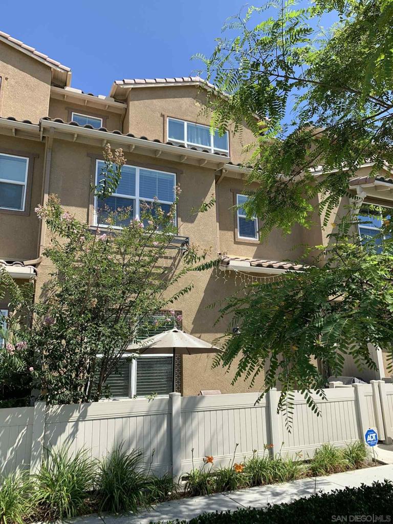 Welcome to this stunning 3-story townhome located in the desirable Village of Montecito Ridge in vibrant Otay Ranch. This light-filled home features 4 bedrooms + a versatile optional bedroom and 3.5 bathrooms, offering flexible space for families, guests, or a home office. The kitchen boasts granite countertops, stainless steel refrigerator, and sleek black appliances, perfect for everyday cooking and entertaining. Built in 2015, the home offers generously sized bedrooms, walk-in closets, a tankless water heater, A/C, and fiber optic cabling for high-speed internet. Additional highlights include a 2-car garage, upstairs laundry room, and a charming front patio to enjoy outdoor relaxation. This great family home is centrally located to amazing schools, parks, shopping, dining and entertainment. Welcome to this stunning 3-story townhome located in the desirable Village of Montecito Ridge in vibrant Otay Ranch. This light-filled home features 4 bedrooms + a versatile optional bedroom and 3.5 bathrooms, offering flexible space for families, guests, or a home office. The kitchen boasts granite countertops, stainless steel refrigerator, and sleek black appliances, perfect for everyday cooking and entertaining. Built in 2015, the home offers generously sized bedrooms, walk-in closets, a tankless water heater, A/C, and fiber optic cabling for high-speed internet. Additional highlights include a 2-car garage, upstairs laundry room, and a charming front patio to enjoy outdoor relaxation. This great family home is centrally located to amazing schools, parks, shopping, dining and entertainment.