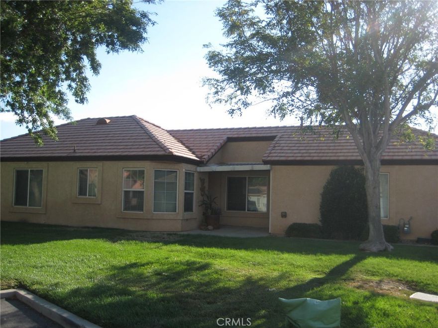 Welcome to your new home in Apple Valley Jess Ranch 55+ community. This home features a 2 bedroom and 2 bath.  Tile entry will take you into the living and dining area with sliding door to the greenbelt area. Kitchen is nice with granite counter tops, pantry, refrigerator, microwave and a area for a coffee bar with cozy eating area. The guest bedroom is nice size with large closet. In the hallway you will find the hall bath with tub/shower, indoor laundry room. The master ensuite has ceiling fan, and master bath has single sink walkin shower and large closet. Also find the 2 car garage and front porch sitting area.  This property is located on the greenbelt so the home feels very open. Come and take a look, you won't be disappointed.