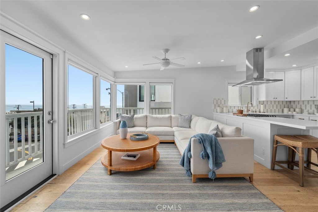 Life feels different at 209 15th Street—lighter, more relaxed, effortlessly stylish. Just two blocks from the sand and only steps to the heart of downtown Manhattan Beach, this 'casual luxury' beach house brings ocean views and coastal charm right to your doorstep. Inside, the Primary suite is situated spaciously and privately on the first floor, with sliders to a small outdoor space. 2 more bedrooms grace the second floor along with the living area. The 3 bedrooms and 2 bathrooms are thoughtfully updated to feel both polished and inviting. The living area opens wide to sweeping blue-water views from the corner picture windows, while the outdoor deck is your front-row seat to sunsets and salty breezes. Gather around the dining banquet, cozy up by the fireplace, or simply enjoy the comfort of A/C on warm days—it’s all part of the easy, elevated lifestyle here. And if you were ever inclined to build a new, 3-story home on the lot, there are completed plans for such a property - already with a Coastal Development Permit issued by the City of Manhattan Beach. From morning surf checks to evening strolls downtown, 209 15th Street isn’t just a home—it’s Manhattan Beach living at its best.