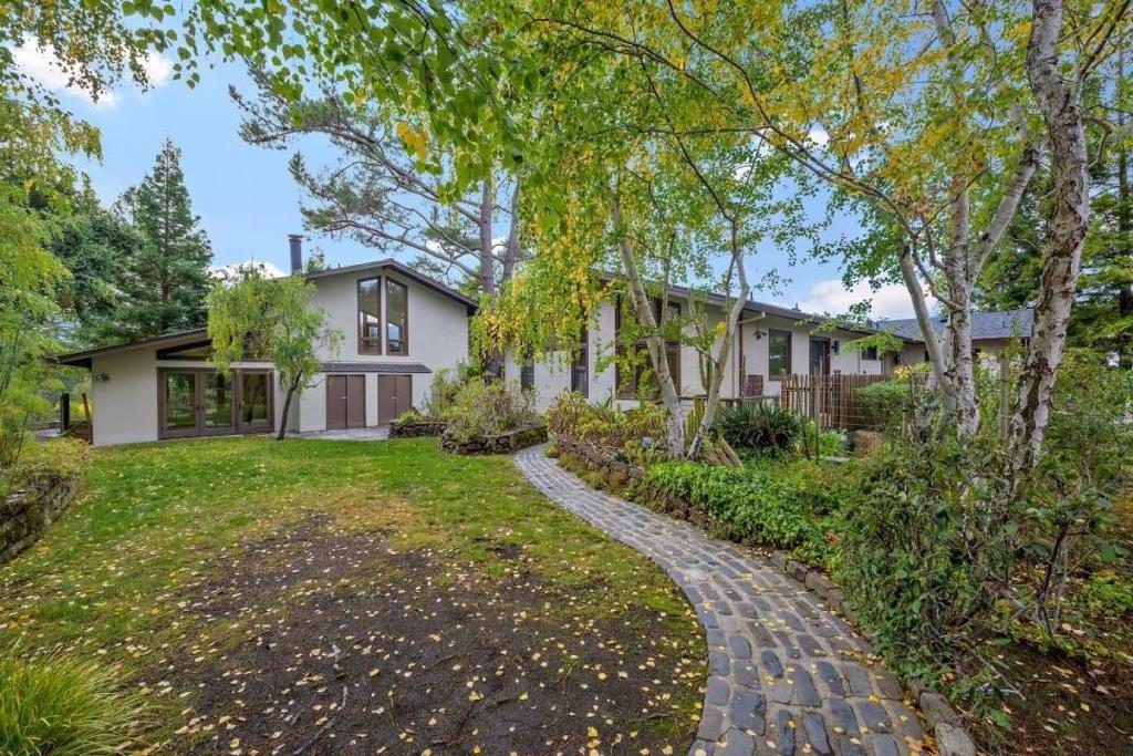 Unobstructed, dramatic views of Windy Hill & Skyline Ridge are available from most rooms of this custom home & guest house. Located in prestigious central Portola Valley, the 1.75-acre+/- lot is private, & has potential for future expansion or building a grand estate. Stepping inside, one notices the floor to ceiling windows in the living room with breathtaking views of Windy Hill/Skyline Ridge. The open floor plan, with high ceilings, moves seamlessly from room to room. Large kitchen has abundant cabinetry, a center island with 6-burner Wolf gas stove, Subzero refrigerator, very large pantry, & spacious informal dining area. Large primary suite has a high ceiling, huge walk-in closet with wardrobe organizer, & primary bath with large, open shower, & separate jetted tub. Guest house offers a full kitchen, bathroom with large tiled shower w/ seat, & large living area. New hi-def comp shingle roof, carpeting, and interior paint. Highly-regarded Ormondale Elementary school is nearby.
