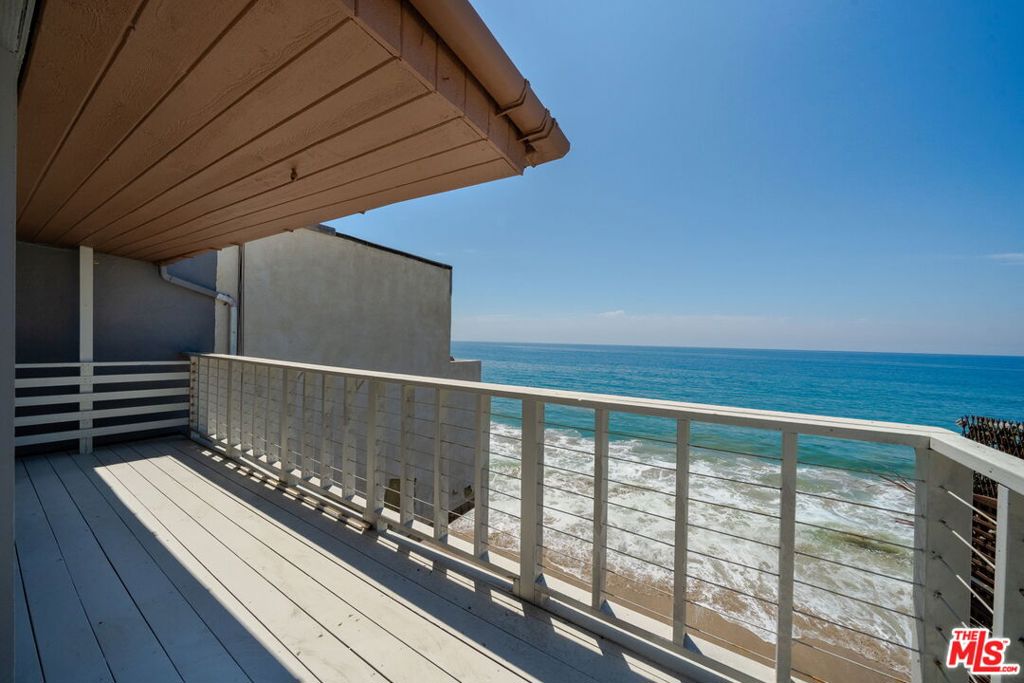 Amazing beachfront rental in a stellar Malibu location that steps to the sand. This classic beach duplex currently has a newly remodeled top-floor 3-bedroom, 1 bathroom unit and offers highly desired amenities such as spacious decks with ocean views, floor-to-ceiling windows, 1-car garage with storage space for bikes/beach gear, and private direct access to the beach. The unit can be configured as a 2-bedroom with a large ocean-facing den or a 3-bedroom with your main bedroom ocean-facing. Located on the top floor with a wrap-around deck perfect for taking in the ocean and sunsets. Laundry in the unit, all new kitchen appliances (the ones in the photos will be replaced with brand new appliances), and the entire building was recently painted, with the unit extensively remodeled. Wonderful Malibu Beach location, steps to the sand, and centrally located between Big Rock and Las Flores Beaches, close to Malibu Pier and Malibu Lagoon State Beach. Pepperdine University and Santa Monica are a quick jaunt away and minutes to dining and entertainment.