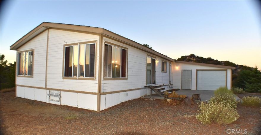 PENDING CURRENT CANCELLATION...Secluded Mountain Home-Gated Neighborhood-Move-in Ready

Recently upgraded, this spacious double-wide features an efficient wood burning fireplace, oversize attached garage, permanent foundation, and large pine trees all around. The property is truly gorgeous: 40+ acres of rugged wilderness, seasonal streams lush with trees and wild flowers, 360- views from every window. Located right on the county line, adjoins State Park to the south and protected wilderness land in every direction. Pacific Coast Trail, Cooper-Cienega Trail, Anza town, and Thomas Mountain are all nearby. Truly peaceful, quiet and private. This is a nature-lover's paradise.



Private well with water softener.                                             Westinghouse water softener

Both 110V and 220V                                                               GE reverse-osmosis.

Propane.                                                                                 

Septic.

Cable/Internet.



LOW LOW tax rate