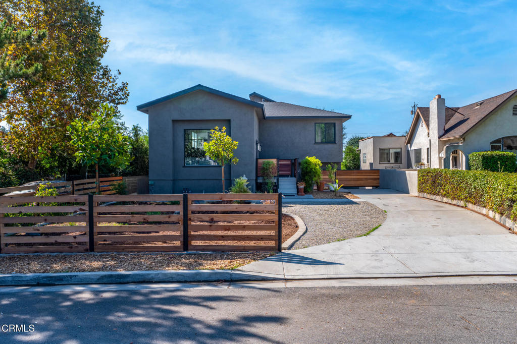 Welcome to this Altadena home, perfectly positioned to face north toward the San Gabriel Mountains. Originally built in 1951, this bungalow was expanded about 8 years ago and now offers approx. 3,211 sq ft. The MAIN RESIDENCE features 2,788 sq ft, while the downstairs GUEST STUDIO adds 423 sq ft of versatile living space with its own entrance.MAIN RESIDENCE--The home showcases a dramatic Great Room with 14-ft ceilings and oversized windows capturing both sunrise and sunset. Plumbing has been installed along the east wall for a potential secondary kitchen. The expansion added 2 bedrooms and 2 bathrooms, including a spacious primary suite with a private south-facing balcony.GUEST STUDIO--The ground-level studio offers 423 sq ft with 1 bedroom, living area with kitchen, and a 3/4 bath, ideal for extended family, guests, or rental income.OUTDOOR LIVING--A 210 sq ft patio is perfect for morning coffee or evening wine with mountain views. The property has been freshly painted on the exterior and updated with new landscaping.CAR ENTHUSIAST'S DREAM--A 6-car garage totaling 1,372 sq ft is complemented by a workshop garage, plus a carport between the garages for extra parking or projects.This rare Altadena offering combines flexible living, stunning mountain views, and unmatched garage capacity in a move-in ready setting.