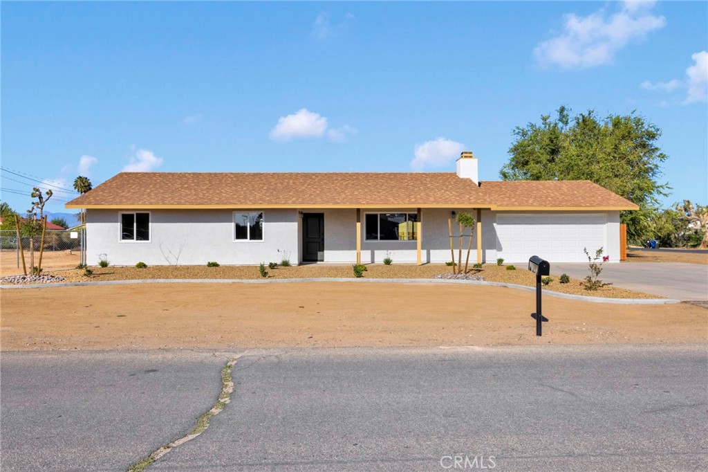 HOME SWEET TURN KEY HOME. Look at this Remodeled Apple Valley 3 Bedroom 2 Bath home. All new dual pane windows and doors and trim inside and outside the whole house including a new garage door. With fresh paint inside and out. New landscaping in the front yard, new Redwood fencing in the backyard. New wood look tile flooring and new carpet. The beautiful new kitchen has modern quartz countertops and new appliances with a separate laundry room attached. The laundry room features cabinets for pantry and storage. Both bathrooms have been updated with new modern quartz countertops, toilets, sinks, fixtures and mirrors. The primary bedroom features a private bath and ceiling fan. All bedrooms have large size closets with new mirrored closet doors. There is all new lighting fixtures inside and outside and the new tankless water heater is a bonus. In addition, this move-in ready home features a fireplace in the living room with a hearth to WELCOME you HOME.