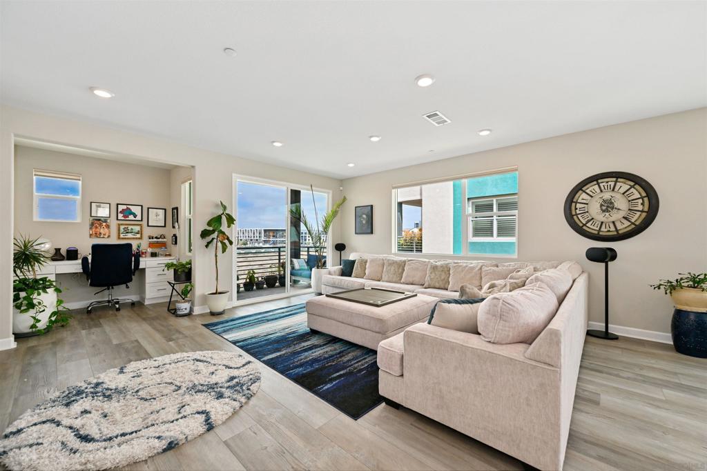 Discover the Best of Millenia Living! This vibrant community offers convenient access to parks, promenades, shops, restaurants, a local market, and more. This stunning west-facing, tri-level corner rowhome features 4 bedrooms and 3.5 bathrooms, including a full bedroom and bath on the first floor—ideal for flexible living. Keep money in your pocket with an owned solar system! Enjoy the comfort of your stylishly upgraded home. The interior showcases luxury vinyl plank flooring throughout, designer lighting, and a bright, open-concept living area. The modern kitchen is equipped with white cabinetry, quartz countertops, a spacious center island, and stainless steel appliances. The top level includes three bedrooms and two full baths, including a spacious primary suite with a walk-in closet and spa-inspired en-suite featuring a soaking tub and dual vanity. Additional highlights include in-unit laundry hook-ups and an attached 2-car garage. Community amenities include a resort-style pool, relaxing spa, and multiple playgrounds. Located just across from Otay Ranch Town Center and near scenic trails and Otay Lake. New dining options like Common Theory Public House and Sura Korean BBQ are just moments away. Don’t miss this incredible opportunity to own in one of the area’s most dynamic neighborhoods!