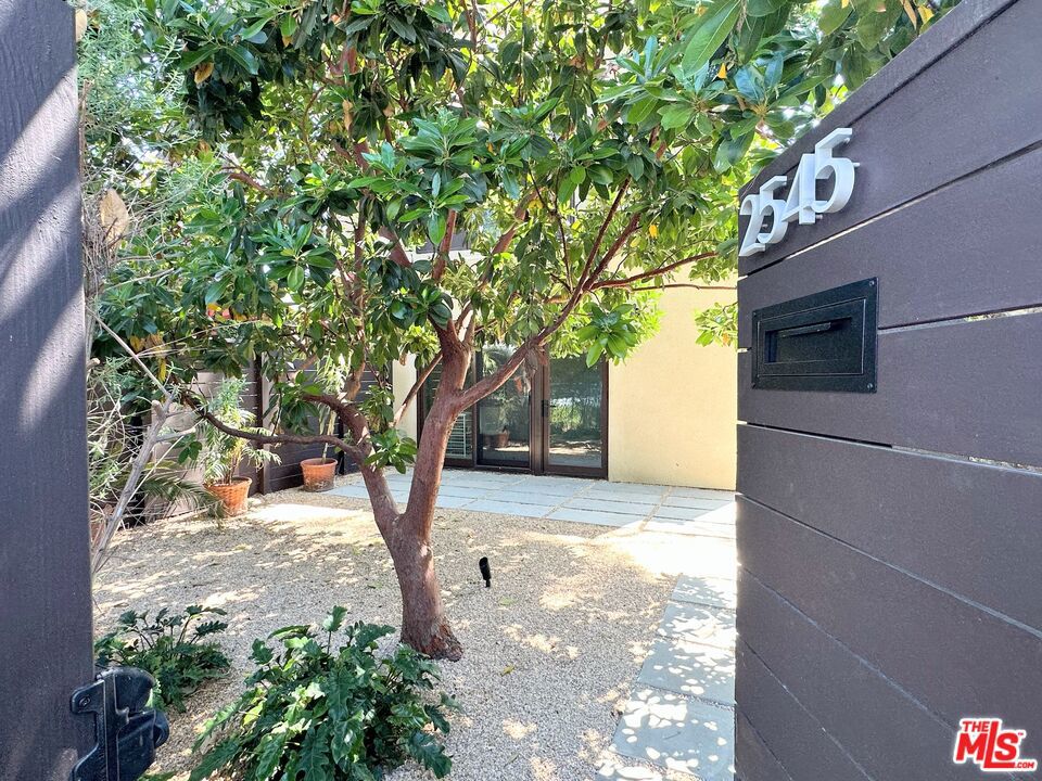 Experience contemporary living in this stunning new construction (2025) residence, masterfully designed by the award-winning architecture firm ORA. This one-bedroom, one-bath home offers a perfect blend of style, comfort, and functionality on a charming tree-lined street in the highly sought-after Rancho Park neighborhood. Spread across two levels, the thoughtfully designed floor plan features vaulted ceilings that create an airy, open feel, while expansive windows fill the space with natural light. The private front yard provides a serene outdoor retreat, ideal for morning coffee or evening relaxation. Inside, enjoy the convenience of in-home laundry, high-quality finishes, and a seamless flow between living spaces. The sleek, modern kitchen and bathroom showcase the home's meticulous attention to detail, while the bedroom is a peaceful sanctuary on the upper level, nestled among the sprawling stone pine tree. Also on the upper level, enjoy the convenience of a meticulously designed bathroom and closet area with in house stacked washer and dryer.The kitchen features high quality finishes and is fully equipped with Beko refrigerator, stove and oven as well as a Bosch dishwasher. The home has a private and direct entrance to the tree lined street and is a five minute walk to the train station.