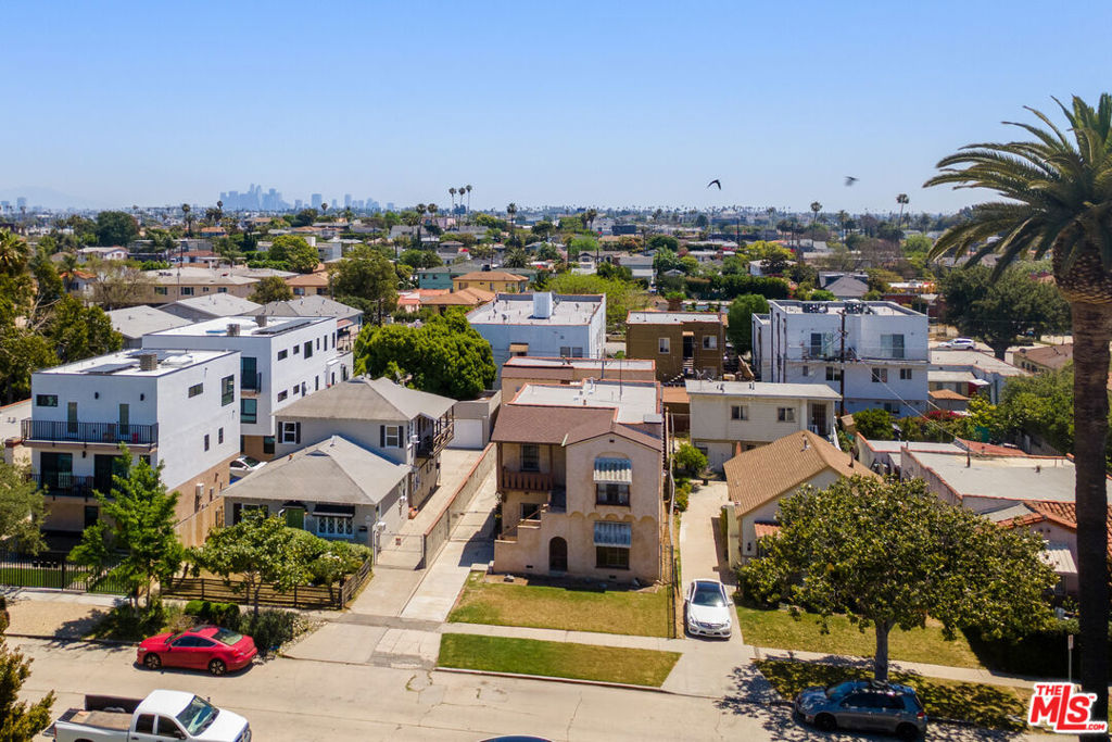TRIPLEX WITH TWO VACANT UNITS -- Do not miss this incredible developer or investor opportunity in the heart of Mid-City! 1744 Carmona Ave is a triplex on a 5,072 SF RD1.5 lot (per assessor), offering prime potential for redevelopment or value-add investment. The existing layout features two vacant 2BD/1BA units in the front (upstairs/downstairs configuration) and a 1BD/1BA unit above a 4-car garage in the rear. With only one unit currently occupied and the rest delivered vacant, this is an ideal canvas for builders, developers, or buy-and-hold investors looking to capitalize on Mid-City's ongoing transformation. A nearly identical lot just doors away at 1734 Carmona Ave was purchased for $1.112M in 2022 and redeveloped into a new 4-unit project that resold for $3.3M clearly illustrating the path to substantial upside. The second story of this property offers sweeping views of Century City don't miss the chance to bring your vision to life in one of LA's most opportunity-rich pockets. *Probate Sale that does not require court approval. All offers to be reviewed Thursday 9/11 5P.