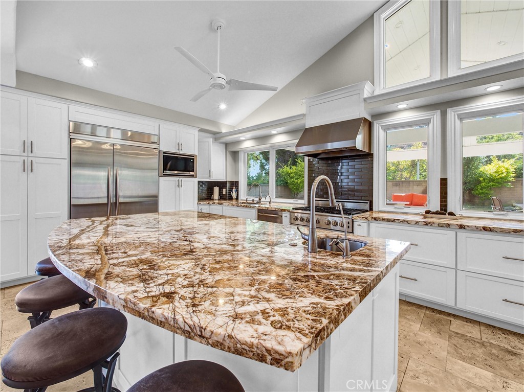 Come enjoy this ABSOLUTELY AMAZING 1-story home in Hidden Hills Estates!! Located on an OVERSIZE Lot with sprawling yard, large Covered Patio, and incredible Sport Court with Basketball Hoop! Soaring Vaulted Ceilings greet you in the Living Room and Kitchen! Upgraded Custom Tile Flooring, Dual Pane Windows, Updated Patio Doors, Fenced-in 15,500 sqft lot, and plenty of natural lighting! Large Family Room with fireplace, Interior Laundry Room, 3 car garage, and so much more! Owners purchased the home with a room in garage which could be utilized as Office! The front yard has a large space Courtyard and rear yard Patio Furniture is INCLUDED in lease! The Kitchen is UPDATED and DELIGHTFUL with built-in refrigerator, plenty of counter space, storage cabinets and separate Island! This home is an Entertainer's Delight! New garage doors upcoming as well as new flooring in Primary Bedroom and Bath! Come Celebrate with family and friends!