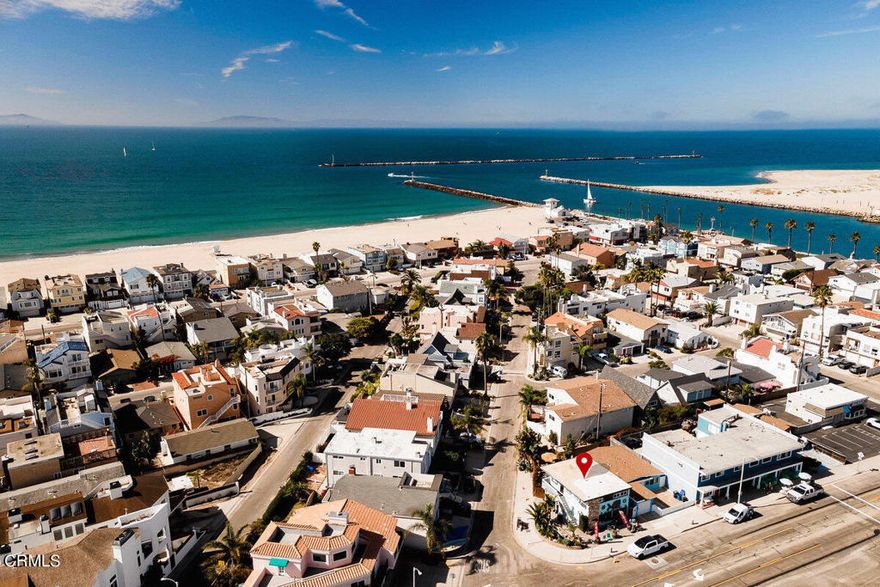 Welcome to a unique and rare opportunity at the heart of Silver Strand Beach--a landmark property that offers the perfect blend of coastal living and business potential. Imagine living just steps from the beach while operating your own business, or renting out either space for additional income.The charming upstairs residence features 2 bedrooms, 1 bathroom, and an inviting open floor plan. The rich wood ceilings and ample windows flood the space with natural light, creating a warm, airy ambiance perfect for coastal living.On the ground floor,  the current gift shop is full of character with multiple creative display spaces, a countertop with a sink, and a full bathroom with a shower. This thoughtfully laid-out space has been crafted with care and offers endless possibilities for any business owner.Situated on a prime corner lot, this property naturally draws people in--whether they're looking for a special treasure in the shop or simply stopping by to say hello. The owner had lovingly transformed the outdoor space around the building into a welcoming retreat, complete with beautiful paver hardscape, lush palm trees, and a tranquil koi pond that enhances the property's charm.This well-established location awaits for the next owner to bring their vision to life in a community that truly embraces the local spirit. Whether you dream of running a beachside business, enjoying the beauty of Silver Strand Beach, or both, imagine the possibilities.