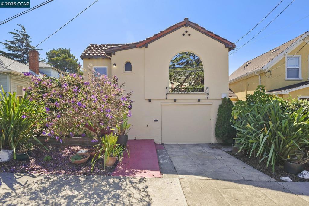 This delightful home blends vintage charm with thoughtful upgrades. A spacious eat-in kitchen with new countertops, refinished original hardwood floors, new windows and fresh interior & exterior paint throughout. The newer roof & compliant sewer lateral provide peace of mind for years to come. Downstairs is a versatile bonus room with built-in bar - ideal for entertaining or relaxing plus a large basement that offers abundant storage space. The covered back patio opens to a lovely garden area surrounded by mature landscaping. Perfect for outdoor dining or quiet afternoons. Close proximity to local hospitals/shopping/dining & convenient freeway access this home is a perfect mix of comfort, convenience & Oakland character.
